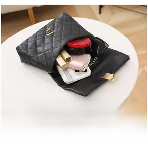 Interior view of black quilted crossbody bag showing spacious storage for daily essentials