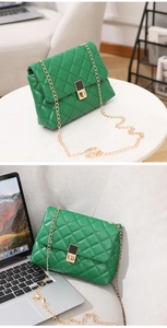 Detail of green quilted crossbody bag with golden chain and stylish rectangular lock