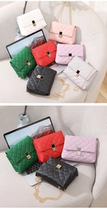 Close-up of quilted chain square bags in multiple colors like white, red and green