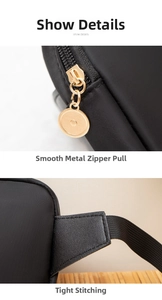 Close-up of black nylon fanny pack with gold zipper detail and reinforced shoulder strap