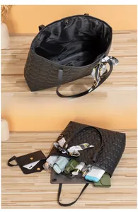 Detail of black heart-quilted tote bag showing large capacity for daily essentials