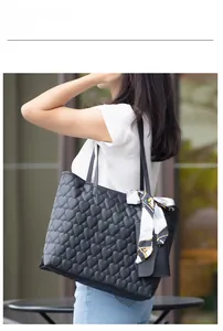 Elegant black quilted heart tote bag with silk scarf and matching mini pouch for women