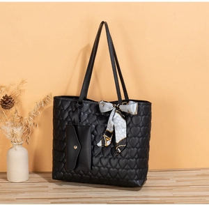 Quilted heart pattern tote bag with matching envelope pouch and geometric silk scarf