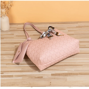 Pink heart-quilted tote bag with decorative geometric silk scarf and matching small pouch