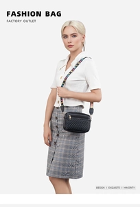 Detail of V-quilted black crossbody bag with colorful LOVE embroidered wide strap