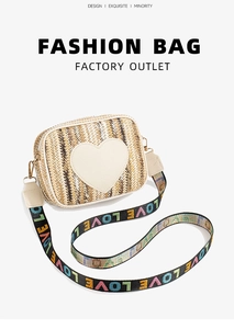 Detail of woven crossbody bag with heart patch and colorful LOVE pattern wide strap