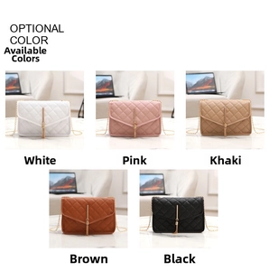 Close-up of diamond quilted crossbody bags with metal tassels in five varied colors