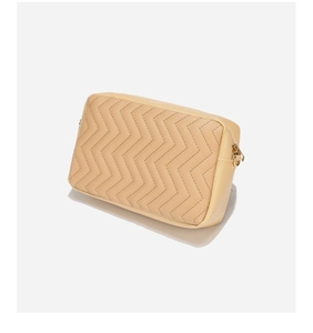Detail view of wave quilted beige shoulder bag with golden metal zipper and D-ring hook