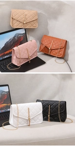 Macro detail of quilted crossbody bags in five colors with metallic tassels and chain