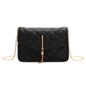 Classic black quilted crossbody bag with golden chain strap and fringe tassel detail