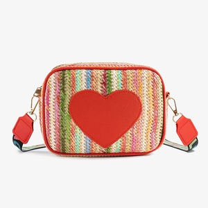 Woven straw crossbody bag with red heart patch and colorful jacquard shoulder strap
