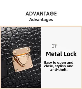 Detail showing high-quality gold hardware lock on black crocodile embossed leather handbag