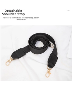 Detail of wide detachable nylon and leather shoulder strap with golden metal swivel hooks