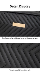 Detail of black V-shaped chevron quilted faux leather bag with gold rectangular hardware