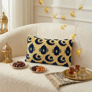 Detail of Ramadan cushion cover with crescent moon and lantern tufted plush texture