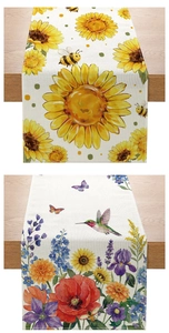 Close-up of linen table runner showing sunflower patterns and woven fabric texture