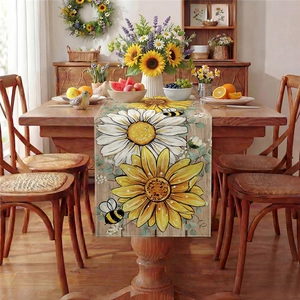 Linen sunflower and daisy table runner with honey bee prints on a rustic wood background