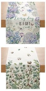 Detailed macro view of linen table runner with Every day IS A GIFT quote and floral print