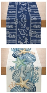 Detailed nautical table runners featuring crab and seashell patterns on linen fabric
