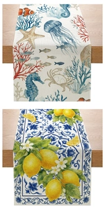 Detail of floral and sea life table runners featuring lemon and seahorse patterns