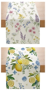Detail of linen table runners with colorful sunflower and lemon floral patterns