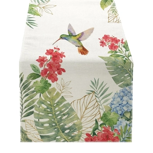 Pastoral table runner featuring hummingbird and red flowers on textured beige linen fabric