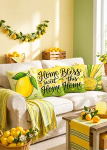 Detail of lemon print cushion covers on a beige sofa with home sweet home text