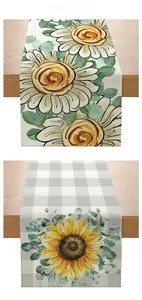 Detail showing rustic sunflower patterns on textured linen fabric table runners