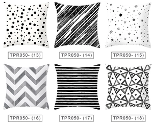 Detailed view of six black and white geometric throw pillow cases in various patterns
