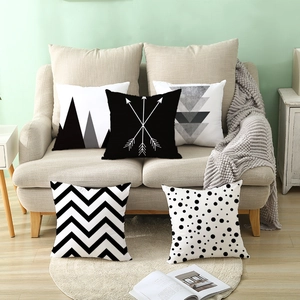 Set of 5 Nordic geometric black and white square pillow covers on a beige fabric sofa