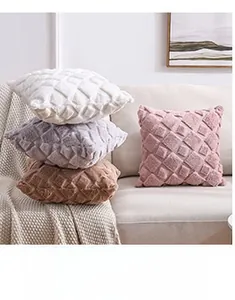 Detail of plush rhombic pattern cushions in various colors for cozy sofa decoration