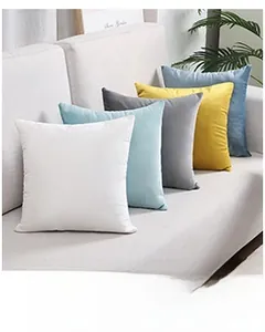 Detailed arrangement of soft Dutch velvet square throw pillows in various solid colors