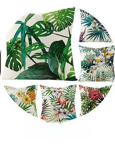 Detail of tropical throw pillow covers with monstera leaf, flamingo and bird patterns