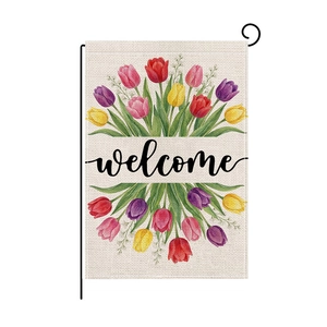 Garden flag with colorful tulips and welcome text on rustic burlap fabric with metal stand