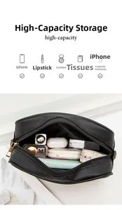 Macro shot of large capacity interior showing phone and cosmetics in black PU camera bag