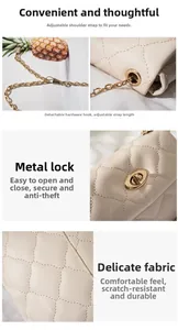 Detail of beige quilted bag showing golden chain strap and twist lock hardware