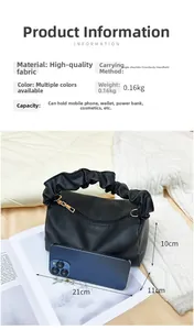 Detail view of black pleated pillow bag showing 21x11x10cm size and 0.16kg lightweight design