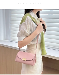 Pink lychee texture crossbody bag featuring a wavy rectangular gold magnetic clasp