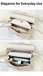 Macro detail of cream crossbody bag showing triple compartments and spacious interior storage