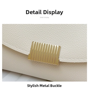 Detail of lychee textured leather and stylish rectangular gold metal buckle on bag