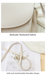 Detailed view of beige litchi grain leather texture and slender shoulder strap of the bag