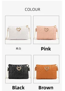 Detail view of quilted leather envelope bags with gold heart buckles in four colors
