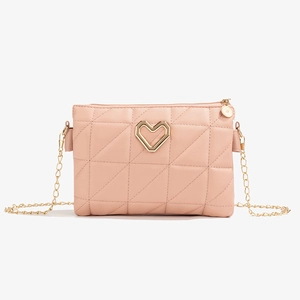 Pink quilted shoulder bag with geometric stitching and golden heart-shaped clasp detail