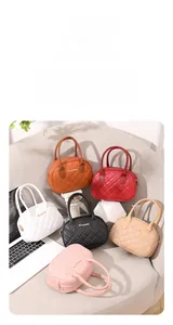 Macro shot of stylish quilted leather handbags in various colors with metal zippers