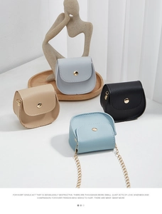 Detailed view of mini semi-circle crossbody bags in four colors with gold chain straps