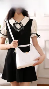 Close-up of white tote bag featuring V-shaped quilting and hexagon pocket for women