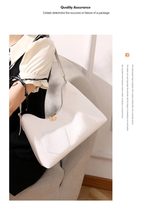 Close-up of white wavy quilted tote bag with golden double circular zippers and front pocket