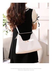Detailed back view of water ripple pattern PU leather crossbody bag worn by a model