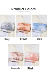 Detailed view of long zip wallets with marble textures and butterfly metal buckles