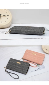 Close-up of long zip wallets showing herringbone texture and gold metallic plate